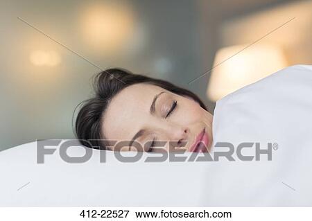 Woman sleeping in her bed View Large Photo Image Stock Photo - Woman sleeping in her bed. Fotosearch