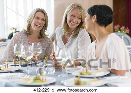 Women enjoying meal in restaurant View Large Photo Image Stock Photography - Women enjoying meal in restaurant. Fotosearch