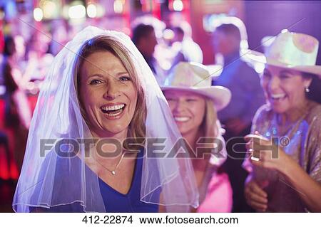Women having fun at bachelorette party, men in background View Large Photo Image Picture - Women having fun at bachelorette party, men in background. Fotosearch