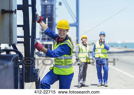 Worker climbing cargo crane View Large Photo Image Stock Photography - Worker climbing cargo crane. Fotosearch