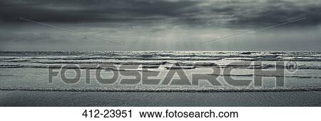 Booby's Bay, Scenic view of sea waves and beach in bay on cloudy day View Large Photo Image Stock Image - Booby's Bay, Scenic view of sea waves and beach in bay on cloudy day. Fotosearch