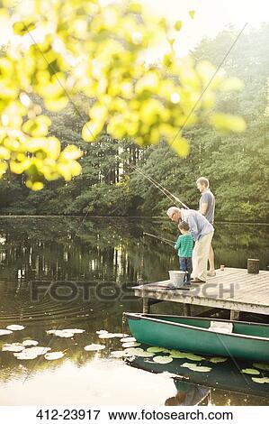 Boy, father and grandfather fishing in lake View Large Photo Image Stock Photo - Boy, father and grandfather fishing in lake. Fotosearch
