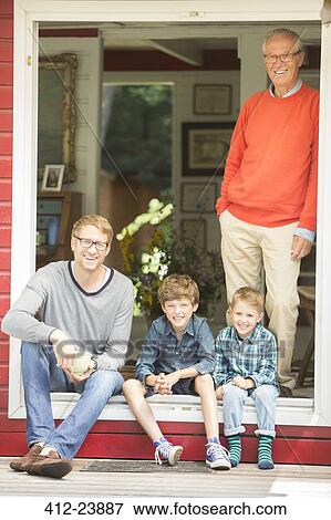 Brothers smiling with father and grandfather View Large Photo Image Stock Photo - Brothers smiling with father and grandfather. Fotosearch