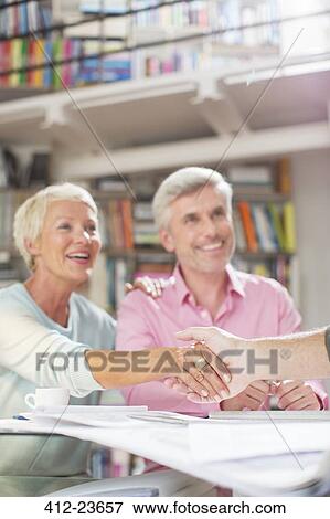 Business people shaking hands in meeting View Large Photo Image Stock Photo - Business people shaking hands in meeting. Fotosearch