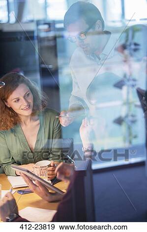 Business people talking in office meeting View Large Photo Image Stock Photo - Business people talking in office meeting. Fotosearch