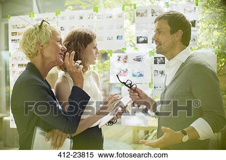 Business people talking in office View Large Photo Image Stock Photography - Business people talking in office. Fotosearch