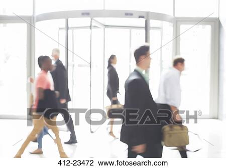 Business people walking in office View Large Photo Image Stock Image - Business people walking in office. Fotosearch