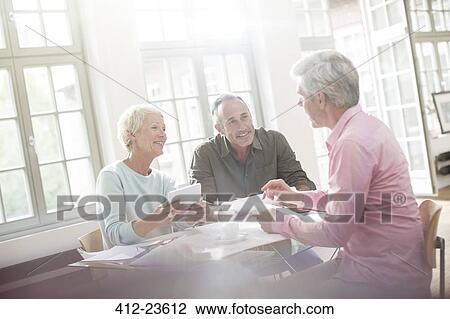 Business people working together at table View Large Photo Image Stock Image - Business people working together at table. Fotosearch