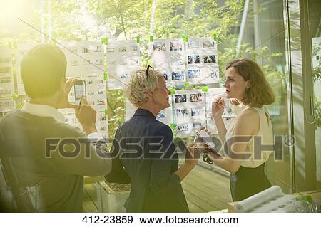 Business people working together in office View Large Photo Image Stock Photo - Business people working together in office. Fotosearch