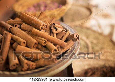 Cinnamon sticks on plate and other spices in background in spice market View Large Photo Image Stock Image - Cinnamon sticks on plate and other spices in background in spice market. Fotosearch