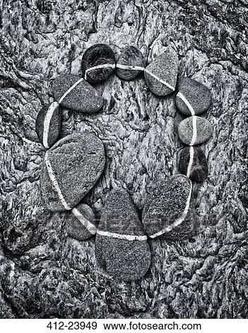 Circle made of stones of different sizes with white line drawn on surface View Large Photo Image Stock Photo - Circle made of stones of different sizes with white line drawn on surface. Fotosearch