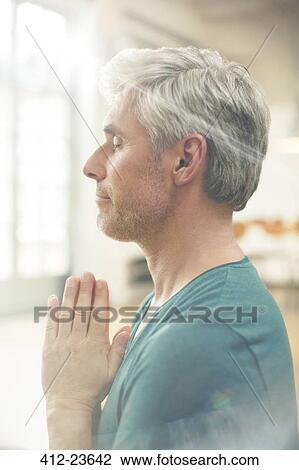 Close up of older man meditating View Large Photo Image Stock Image - Close up of older man meditating. Fotosearch