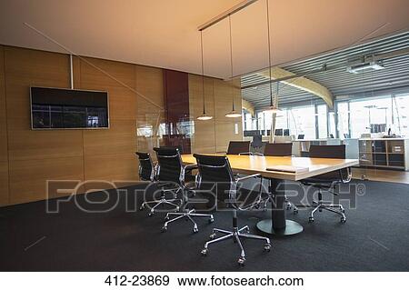 Stock Photo - Conference table in empty office meeting room. Fotosearch