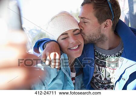 Couple kissing outdoors View Large Photo Image Stock Image - Couple kissing outdoors. Fotosearch