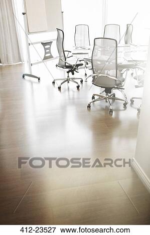 Empty conference room with conference table, office chairs, and whiteboard View Large Photo Image Stock Photo - Empty conference room with conference table, office chairs, and whiteboard. Fotosearch