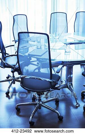 Empty conference room with documents and glasses of water on table View Large Photo Image Stock Image - Empty conference room with documents and glasses of water on table. Fotosearch