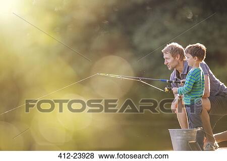 Father and son fishing in lake View Large Photo Image Stock Photo - Father and son fishing in lake. Fotosearch