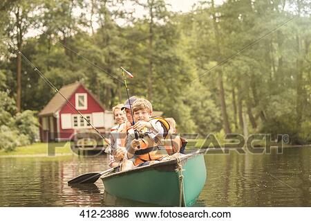 Father and sons fishing from canoe in lake View Large Photo Image Stock Photograph - Father and sons fishing from canoe in lake. Fotosearch