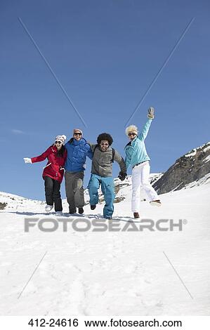 Stock Photograph - Friends playing in snow. Fotosearch