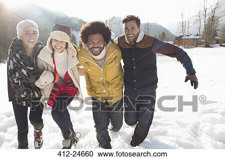 Friends running in snow View Large Photo Image Stock Image - Friends running in snow. Fotosearch