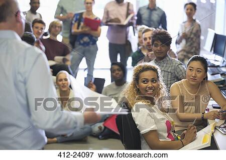 Group of students listening to teacher during lecture View Large Photo Image Stock Photo - Group of students listening to teacher during lecture. Fotosearch