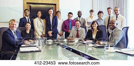 Group portrait of smiling business people in conference room View Large Photo Image Stock Image - Group portrait of smiling business people in conference room. Fotosearch