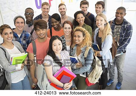 Group portrait of university students standing together in corridor View Large Photo Image Stock Image - Group portrait of university students standing together in corridor. Fotosearch