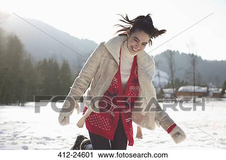 Stock Image - Happy woman in snow. Fotosearch
