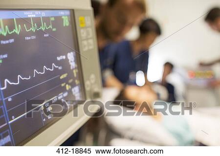 Heart rate monitor, patient and doctors in background in intensive care unit View Large Photo Image Stock Photography - Heart rate monitor, patient and doctors in background in intensive care unit. Fotosearch