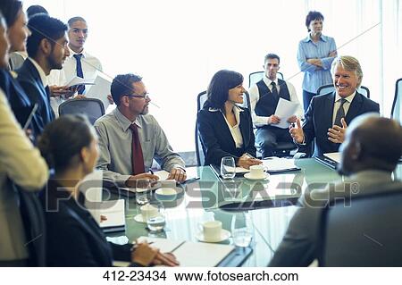 Large group of business people having meeting in conference room View Large Photo Image Picture - Large group of business people having meeting in conference room. Fotosearch