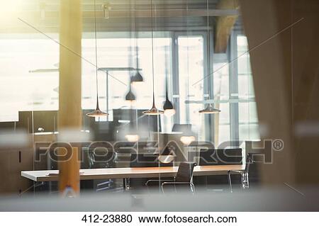 Light fixtures and desks in empty office View Large Photo Image Stock Image - Light fixtures and desks in empty office. Fotosearch