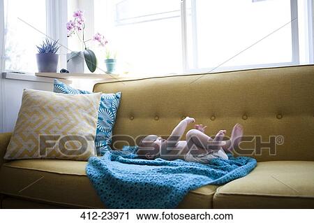 Little baby lying on blue cloth with arms and legs raised View Large Photo Image Stock Image - Little baby lying on blue cloth with arms and legs raised. Fotosearch