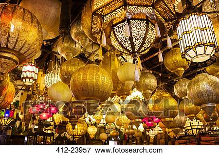 Low angle view of various illuminated lamps in market View Large Photo Image Stock Photo - Low angle view of various illuminated lamps in market. Fotosearch