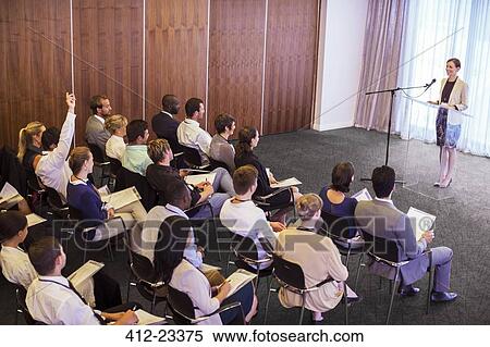 Mid adult businesswoman giving presentation in conference room View Large Photo Image Stock Photography - Mid adult businesswoman giving presentation in conference room. Fotosearch