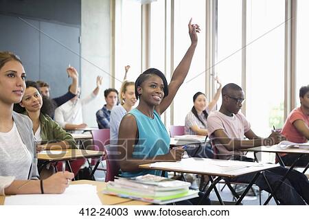 Motivated university students raising their hands at seminar View Large Photo Image Stock Image - Motivated university students raising their hands at seminar. Fotosearch