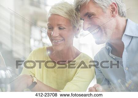 Stock Photo - Older couple laughing together. Fotosearch