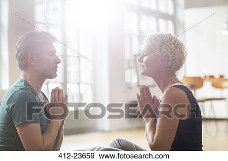 Older couple meditating View Large Photo Image Stock Photo - Older couple meditating. Fotosearch
