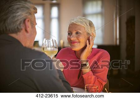 Older couple toasting each other with white wine View Large Photo Image Stock Photography - Older couple toasting each other with white wine. Fotosearch