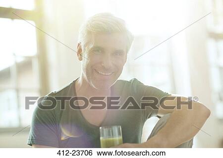 Older man drinking glass of juice View Large Photo Image Stock Photograph - Older man drinking glass of juice. Fotosearch