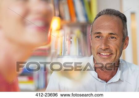 Older man smiling at wife View Large Photo Image Stock Photograph - Older man smiling at wife. Fotosearch