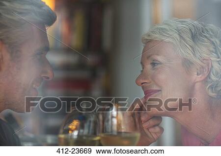 Older romantic couple drinking white wine View Large Photo Image Stock Photo - Older romantic couple drinking white wine. Fotosearch