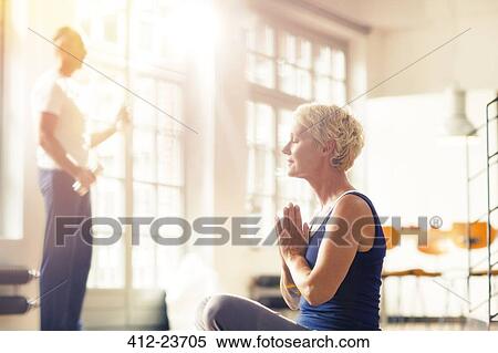 Older woman meditating on floor View Large Photo Image Stock Photography - Older woman meditating on floor. Fotosearch