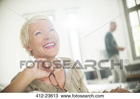 Older woman smiling indoors View Large Photo Image Stock Image - Older woman smiling indoors. Fotosearch