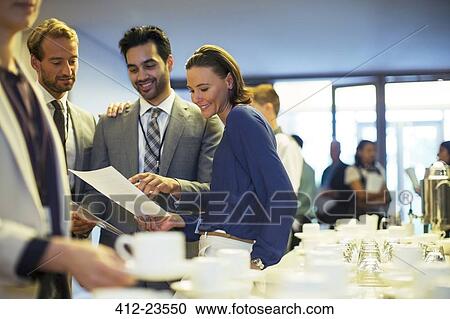 Portrait of businesspeople in lobby of conference center during coffee break View Large Photo Image Stock Image - Portrait of businesspeople in lobby of conference center during coffee break. Fotosearch