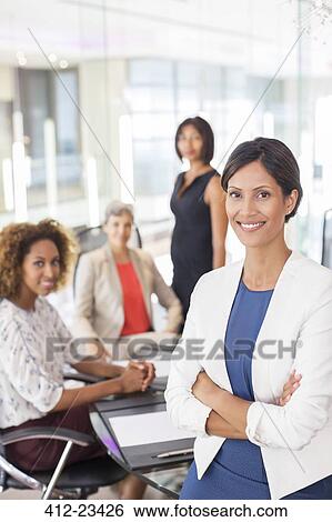 Portrait of businesswoman in conference room View Large Photo Image Stock Photograph - Portrait of businesswoman in conference room. Fotosearch
