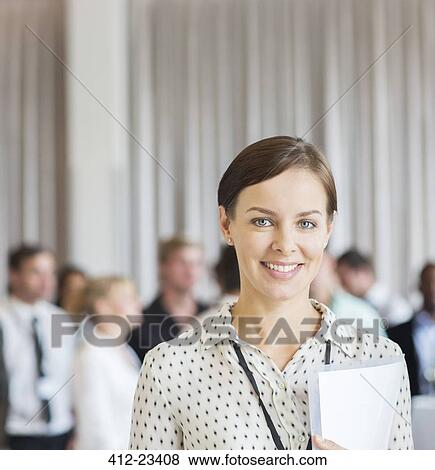 Portrait of businesswoman in office with document in hand View Large Photo Image Stock Photo - Portrait of businesswoman in office with document in hand. Fotosearch