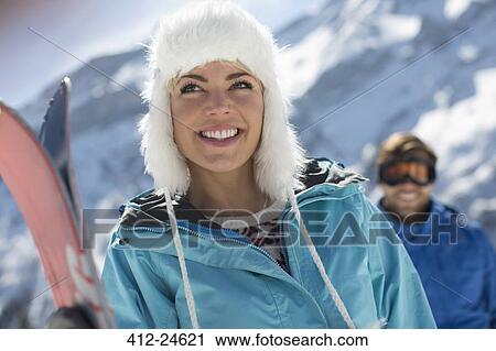 Portrait of confident woman with skis View Large Photo Image Stock Image - Portrait of confident woman with skis. Fotosearch