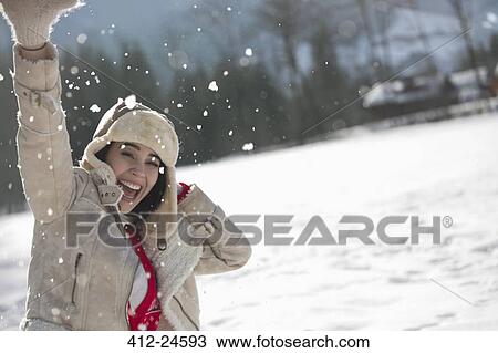 Portrait of exuberant woman in snow View Large Photo Image Stock Image - Portrait of exuberant woman in snow. Fotosearch