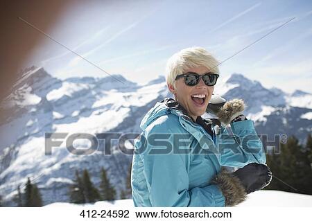 Portrait of laughing woman in snow View Large Photo Image Stock Image - Portrait of laughing woman in snow. Fotosearch