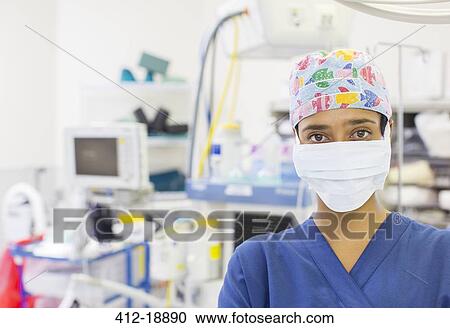 Portrait of nurse wearing colorful surgical cap and mask in operating theater View Large Photo Image Stock Image - Portrait of nurse wearing colorful surgical cap and mask in operating theater. Fotosearch